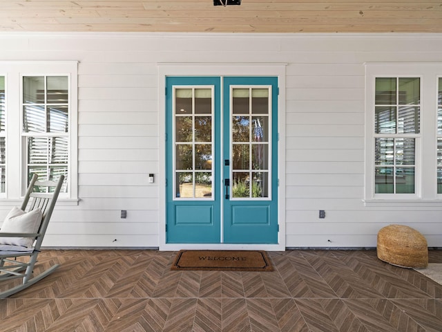 view of exterior entry featuring french doors