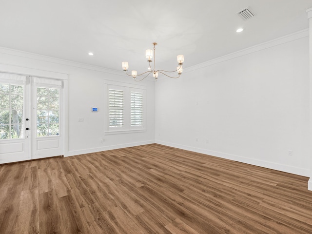 interior space with crown molding, dark wood-type flooring, and an inviting chandelier