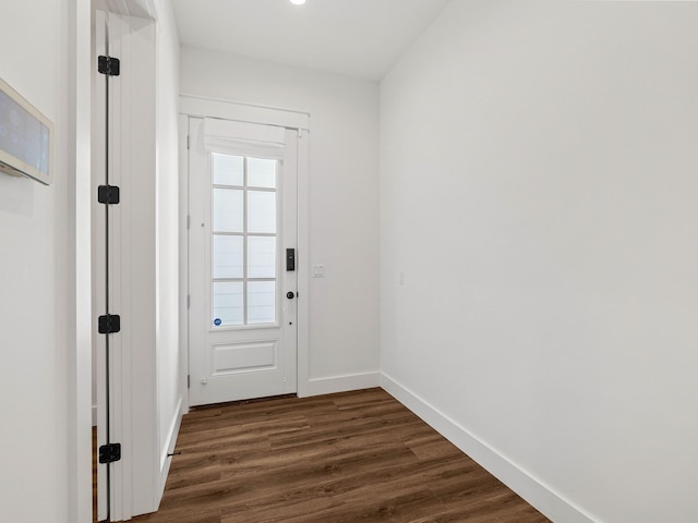 doorway to outside with dark hardwood / wood-style floors