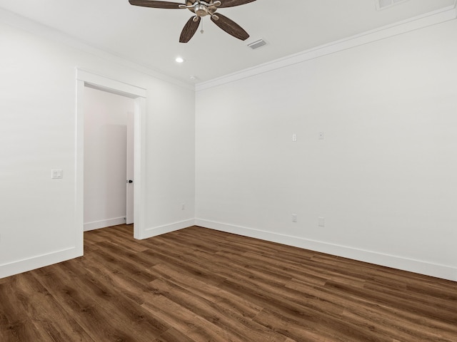 empty room featuring ornamental molding, ceiling fan, and dark hardwood / wood-style flooring