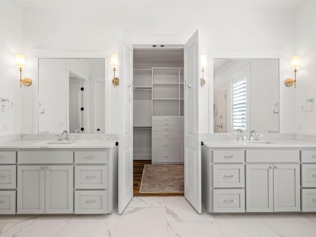 bathroom featuring vanity and ornamental molding