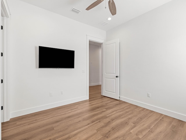 unfurnished bedroom with light hardwood / wood-style floors and ceiling fan