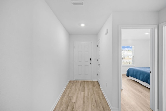 corridor featuring light wood-type flooring