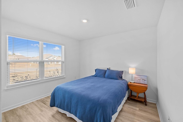 bedroom with light hardwood / wood-style flooring