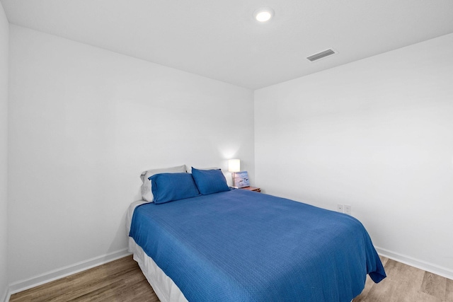 bedroom with wood-type flooring