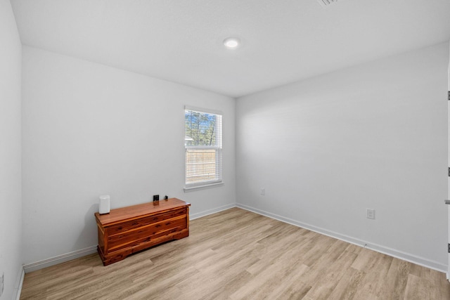 spare room featuring light hardwood / wood-style floors