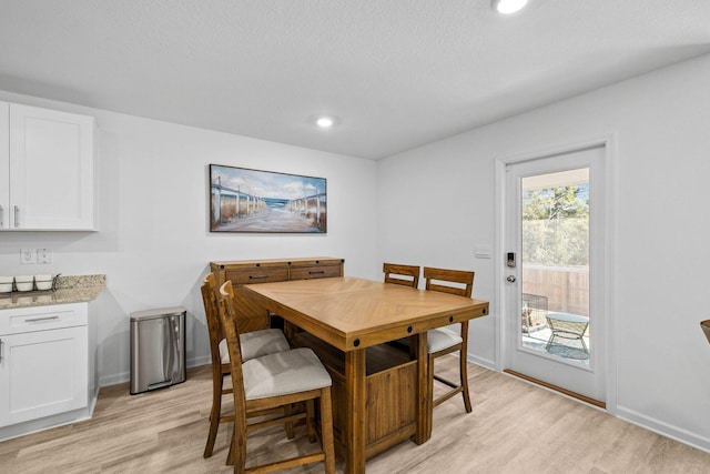 dining area with light hardwood / wood-style floors