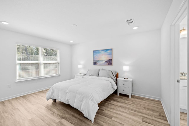 bedroom with light hardwood / wood-style floors