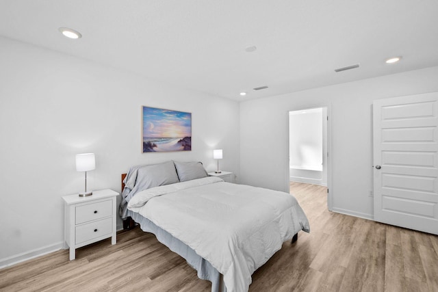 bedroom featuring light hardwood / wood-style floors