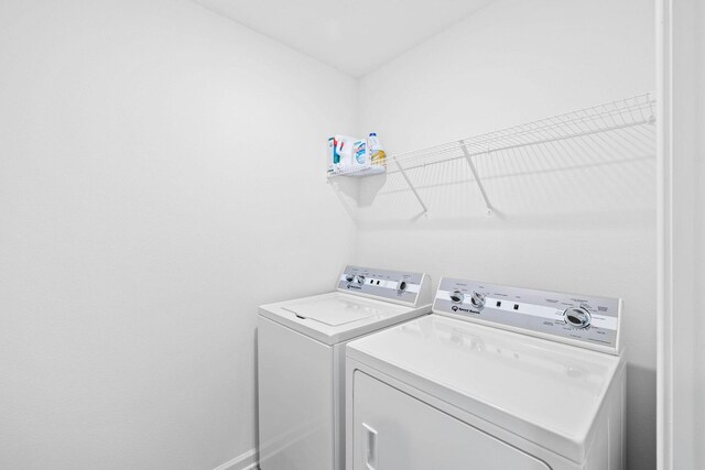 washroom featuring separate washer and dryer