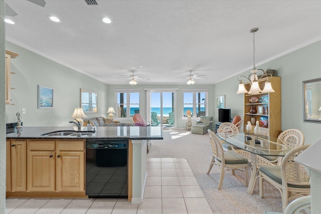 kitchen with sink, light carpet, a textured ceiling, dishwasher, and pendant lighting