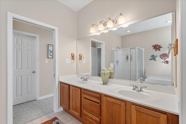 bathroom with independent shower and bath, vanity, and tile patterned floors