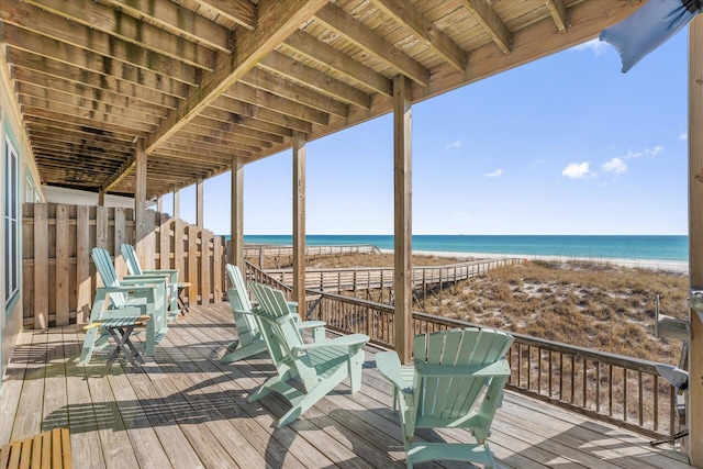 deck featuring a water view and a view of the beach