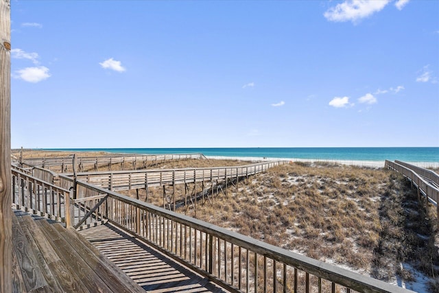 exterior space with a water view and a view of the beach