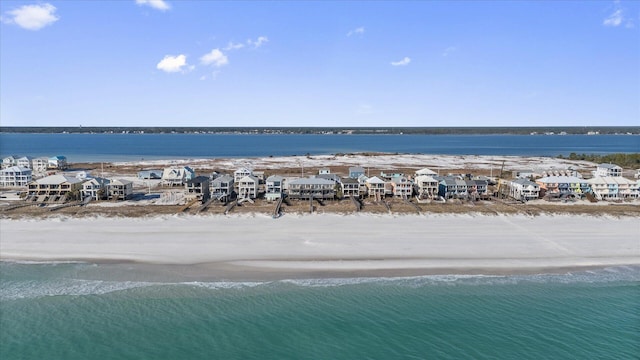 drone / aerial view with a water view and a view of the beach