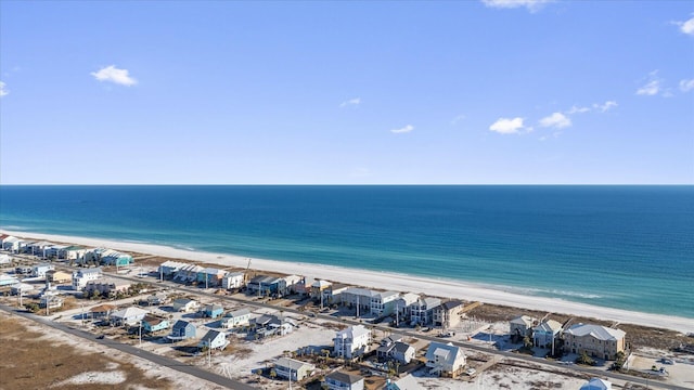 drone / aerial view with a water view and a view of the beach