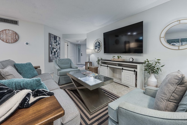 living room featuring a textured ceiling