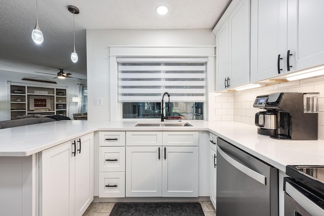 kitchen with white cabinets, dishwasher, sink, hanging light fixtures, and kitchen peninsula