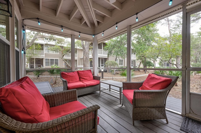 sunroom / solarium with wooden ceiling, beamed ceiling, and a healthy amount of sunlight