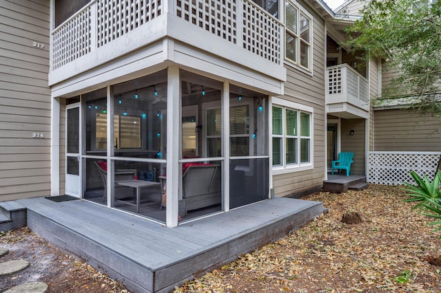 wooden terrace with a sunroom