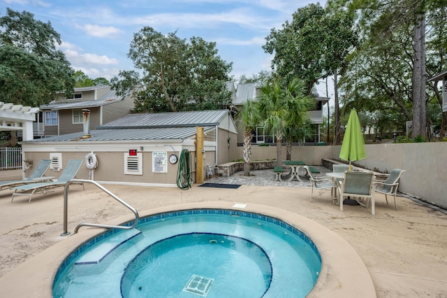 view of pool featuring a community hot tub and a patio