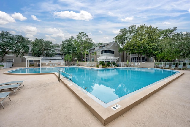 view of pool with a pergola and a patio area