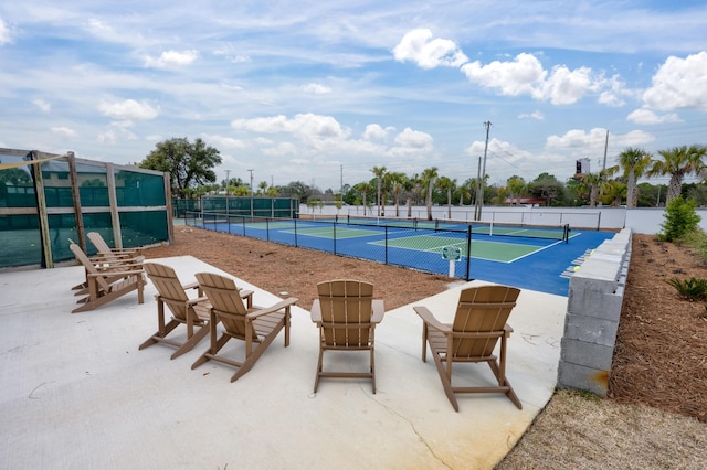 view of pool featuring tennis court