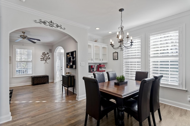 dining room featuring crown molding, ceiling fan, and light hardwood / wood-style floors