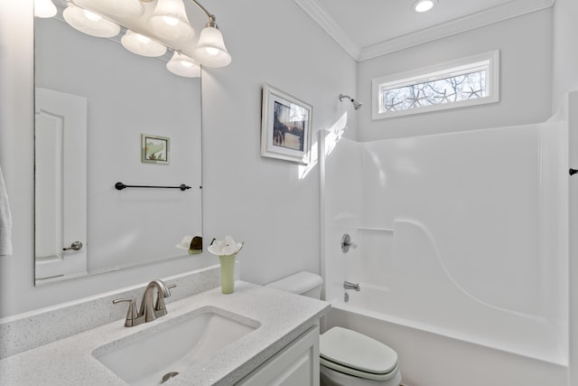 full bathroom featuring crown molding, bathtub / shower combination, vanity, and toilet