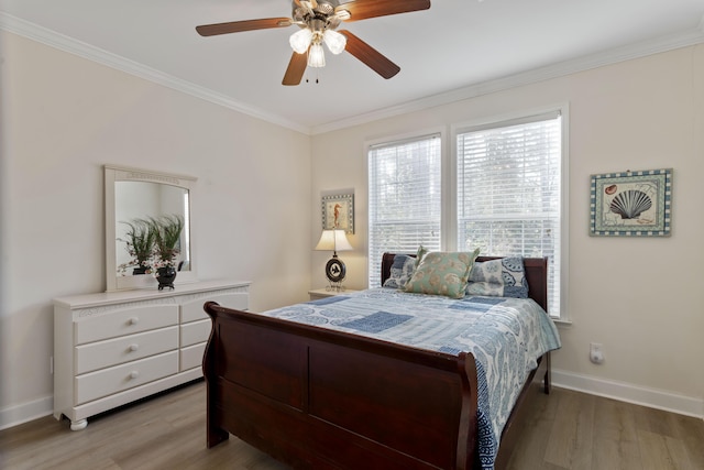 bedroom with ceiling fan, ornamental molding, and light hardwood / wood-style floors