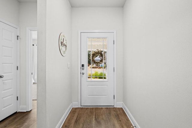 doorway with dark hardwood / wood-style floors