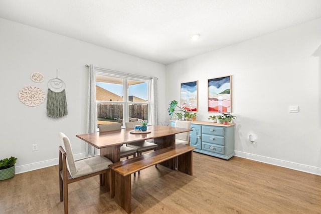 dining room with light hardwood / wood-style flooring