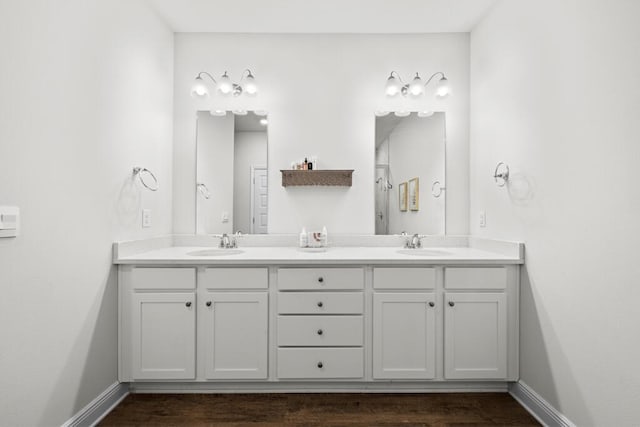 bathroom featuring hardwood / wood-style floors and vanity