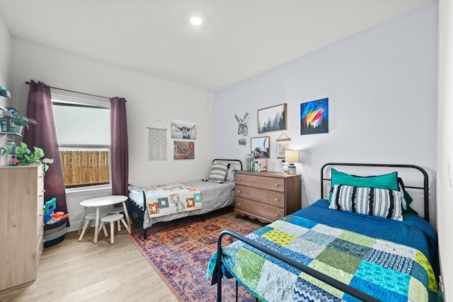 bedroom with light wood-type flooring