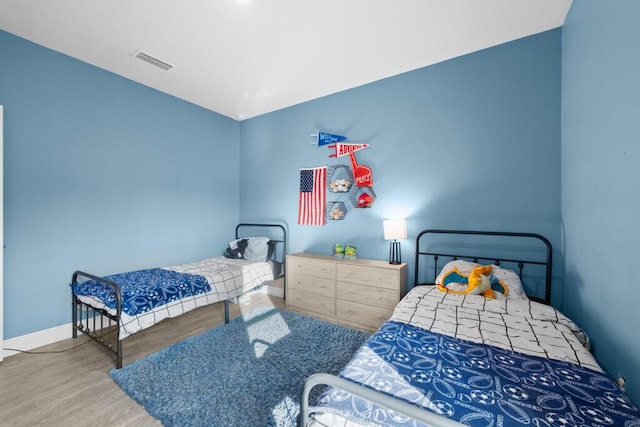 bedroom featuring wood-type flooring