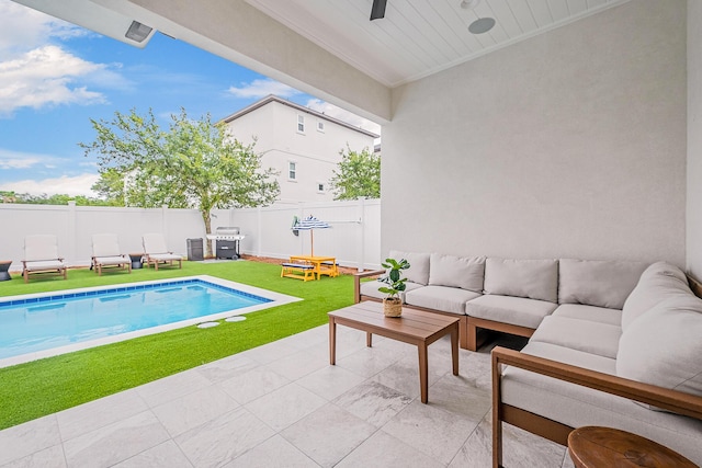 view of swimming pool featuring an outdoor living space, a patio area, a yard, and a grill