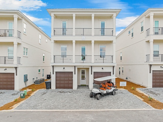 view of front facade featuring a balcony and cooling unit