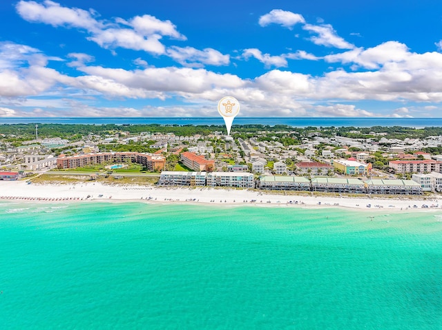 drone / aerial view featuring a water view and a view of the beach