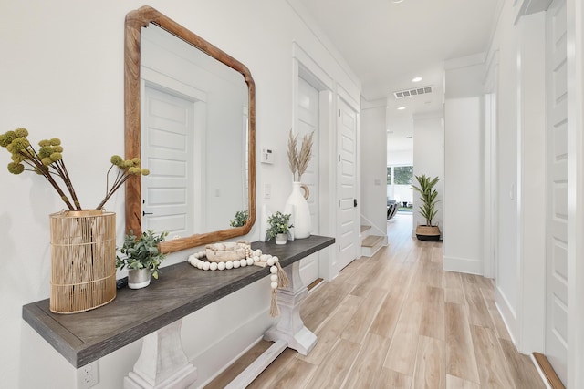 corridor featuring light hardwood / wood-style floors