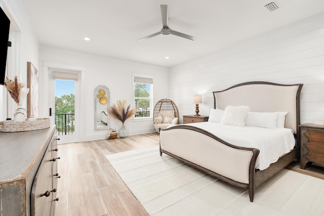 bedroom featuring light wood-type flooring, access to exterior, ceiling fan, and crown molding