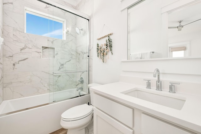 full bathroom featuring bath / shower combo with glass door, toilet, and vanity