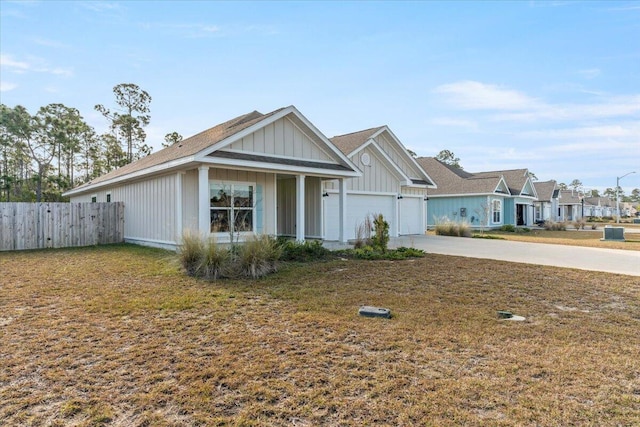 view of front of house with a garage and a front yard