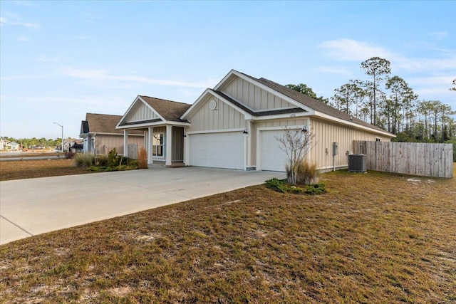 view of front of house with central AC and a garage