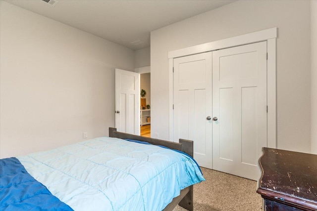 bedroom featuring a closet and carpet