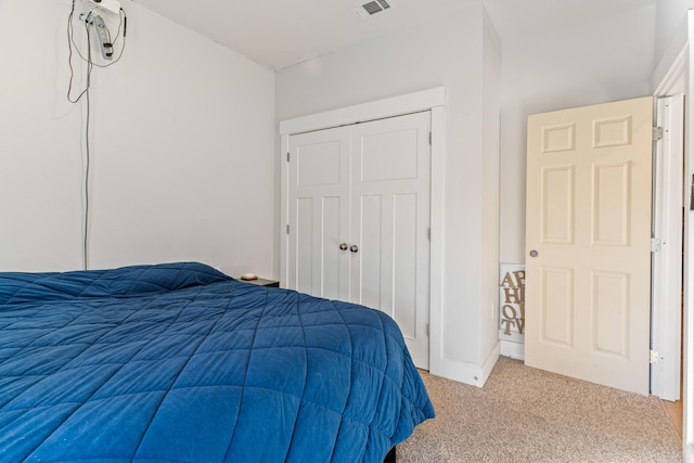 carpeted bedroom featuring a closet