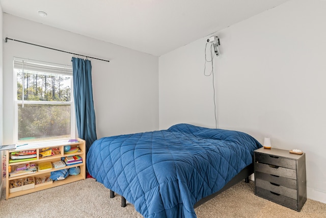 bedroom with light carpet