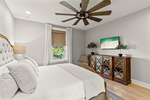 bedroom featuring ceiling fan and light wood-type flooring