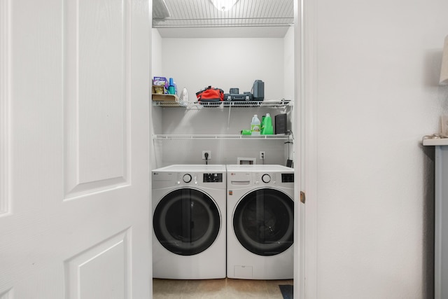 laundry room with independent washer and dryer