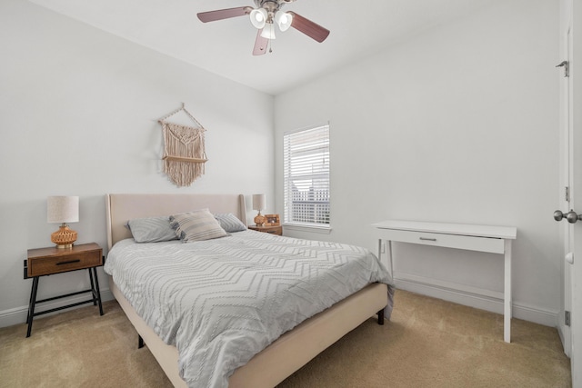 bedroom with light carpet and ceiling fan