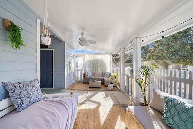 sunroom featuring ceiling fan and a wealth of natural light